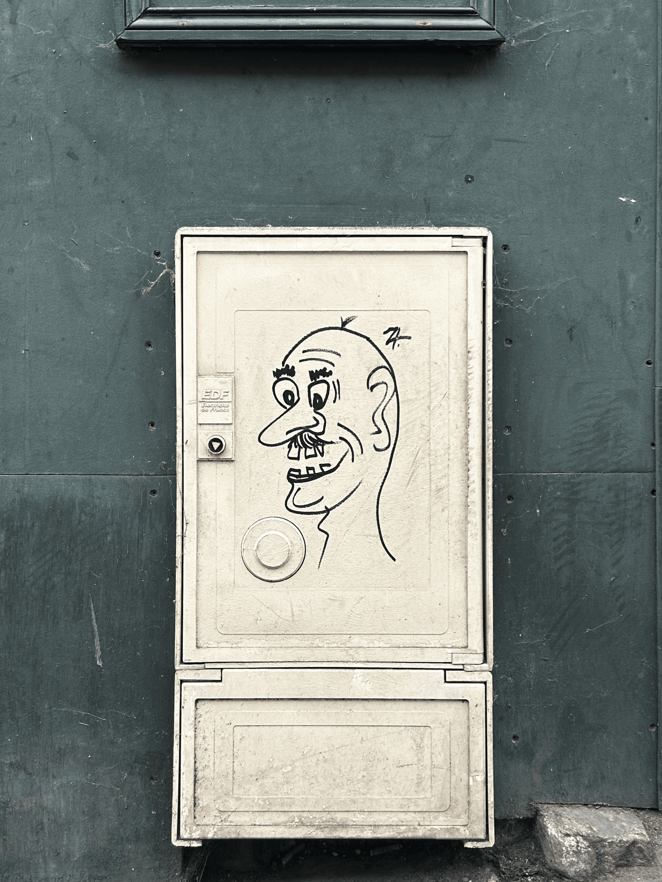 Graffiti of a man on a phone box
